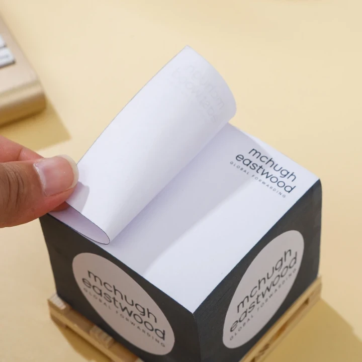 Branded 2.95 x 2.95 inch sticky note cube with 500 sheets, custom printed on all sides and shrink-wrapped on wood pallet