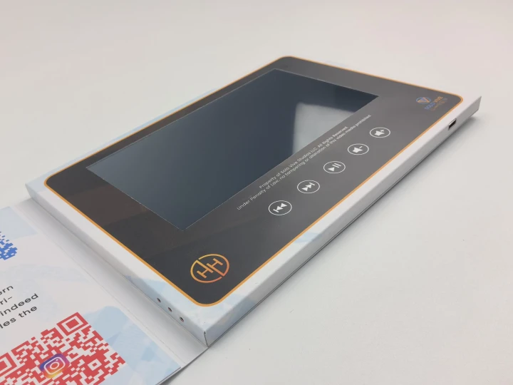 Custom printed video brochure featuring a large IPS screen and control buttons, ideal for branded product presentations and high-impact marketing campaigns.