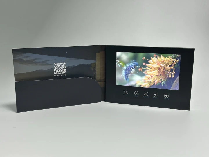 Premium video brochure with built-in screen and custom buttons, featuring a full-color wildlife video and a sleek black pocket design with a QR code for additional content — ideal for luxury real estate, hospitality, or high-end campaigns.